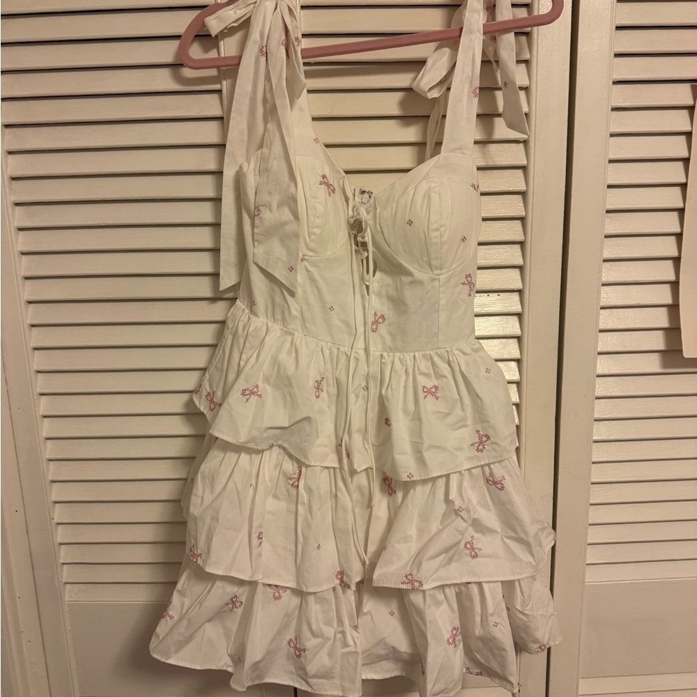 White Ruffled Dress with Pink Accents